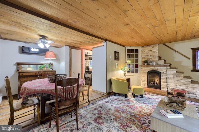 302 6th St, Mount Gretna, PA 17064 - dining area featuring wooden ceiling, ceiling fan, wood finished floors, a stone fireplace, and stairs