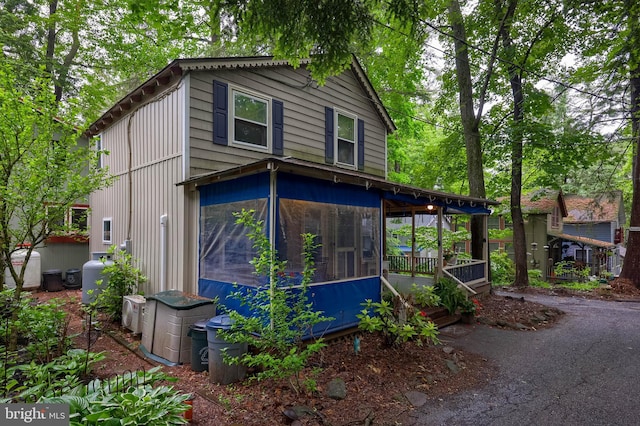302 6th St, Mount Gretna, PA 17064 - view of front of home with a sunroom