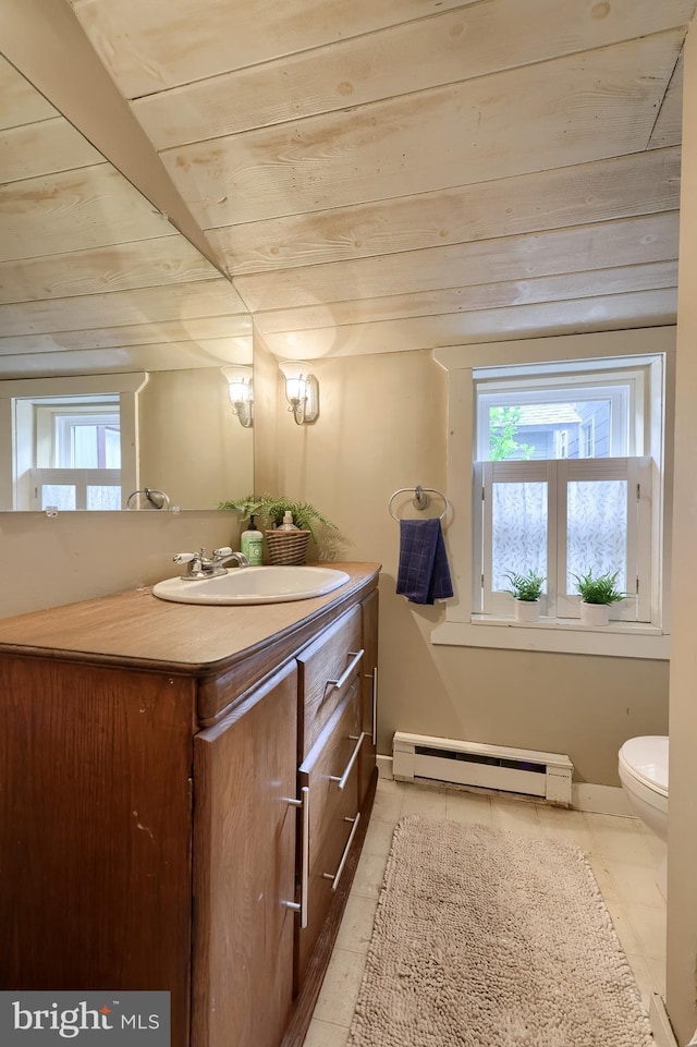 302 6th St, Mount Gretna, PA 17064 - half bathroom with baseboard heating, toilet, vanity, wooden ceiling, and tile patterned floors