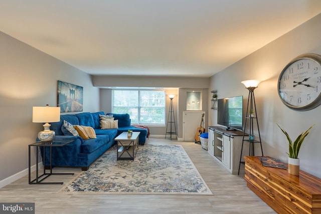 7621 Tremayne Pl Unit 205, Mclean, VA 22102 - living room with light wood finished floors and baseboards