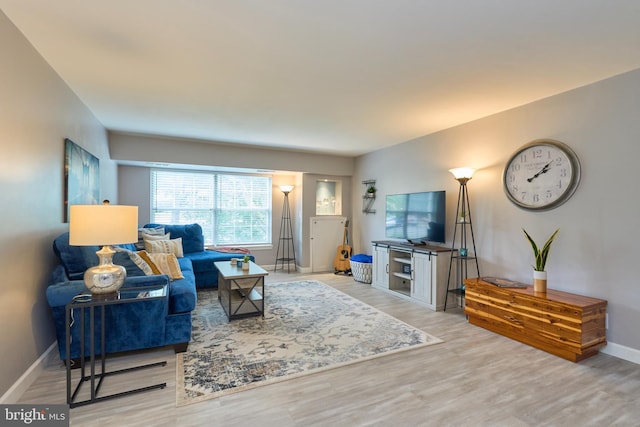 7621 Tremayne Pl Unit 205, Mclean, VA 22102 - living room featuring baseboards and wood finished floors