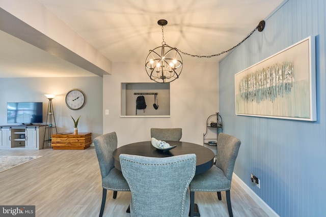 7621 Tremayne Pl Unit 205, Mclean, VA 22102 - dining room with wood finished floors, a chandelier, and baseboards