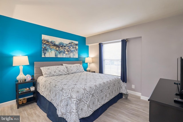 7621 Tremayne Pl Unit 205, Mclean, VA 22102 - bedroom featuring wood finished floors and baseboards