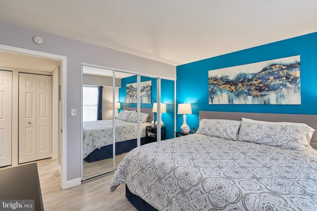 7621 Tremayne Pl Unit 205, Mclean, VA 22102 - bedroom featuring wood finished floors, a closet, and baseboards
