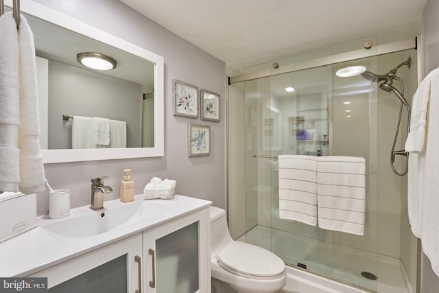 7621 Tremayne Pl Unit 205, Mclean, VA 22102 - bathroom with vanity, a stall shower, and toilet