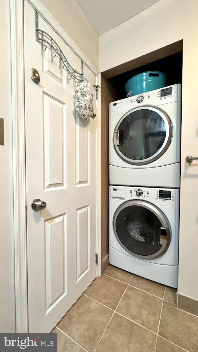 207 Walnut Hill Rd Unit B17, West Chester, PA 19382 - laundry area with stacked washer / dryer and tile patterned floors