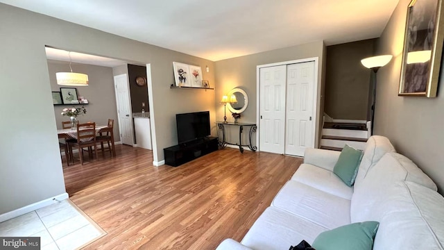 207 Walnut Hill Rd Unit B17, West Chester, PA 19382 - living room with light wood finished floors and stairway