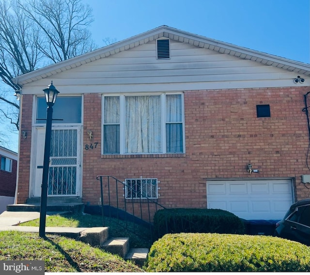 847 Hilltop Ter SE, Washington, DC 20019 - view of front facade with an attached garage and brick siding