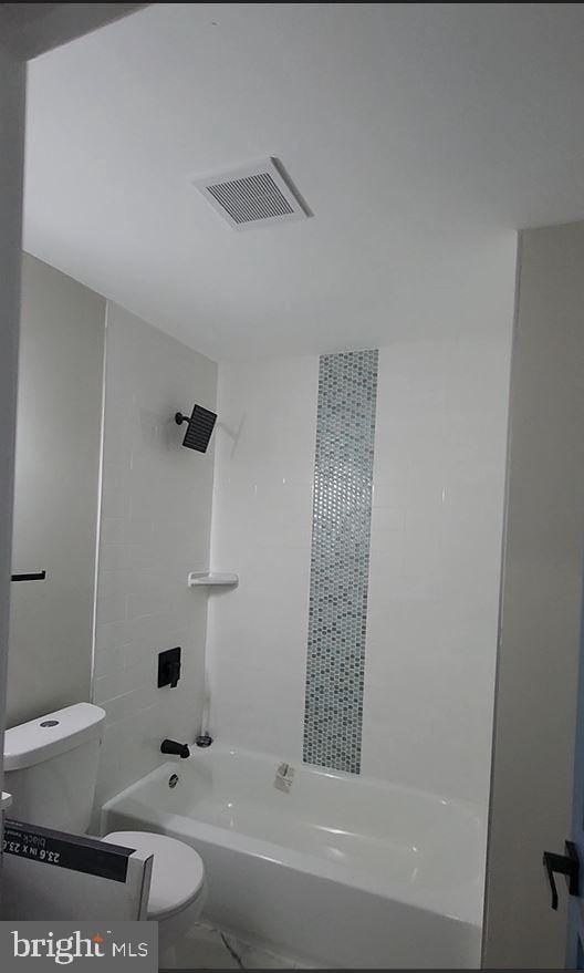 901 N Luzerne Ave, Baltimore, MD 21205 - bathroom featuring toilet, tub / shower combination, and marble finish flooring