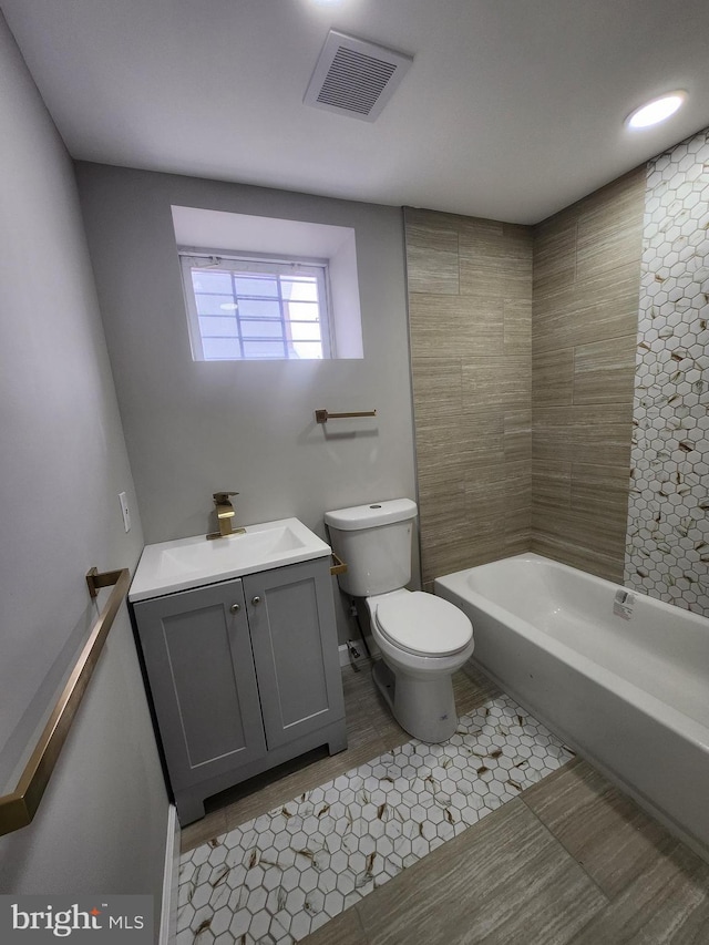 901 N Luzerne Ave, Baltimore, MD 21205 - full bathroom with toilet, vanity, tile patterned floors, and bathing tub / shower combination