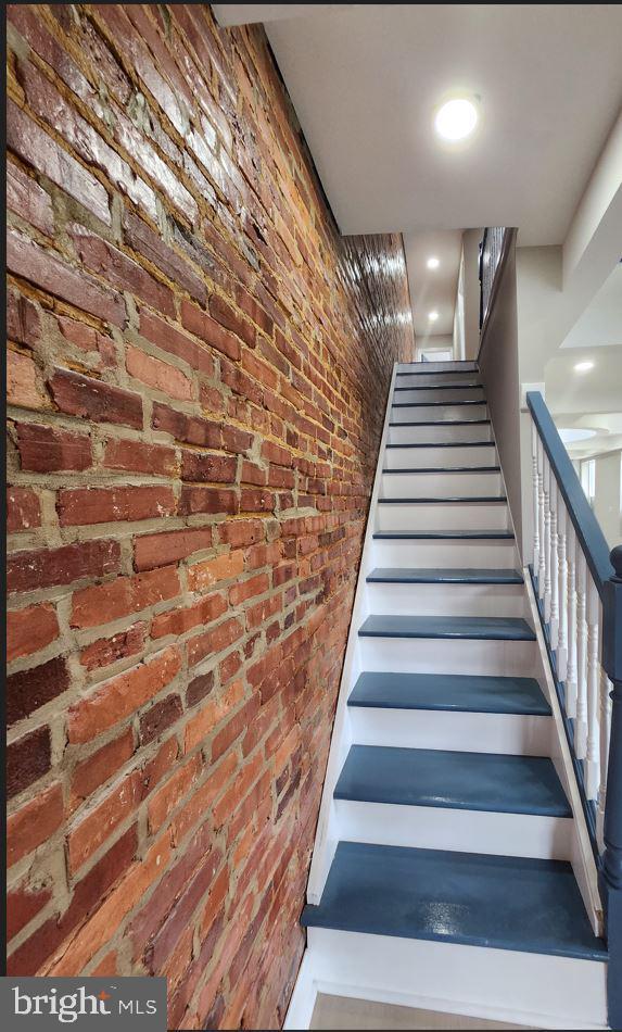 901 N Luzerne Ave, Baltimore, MD 21205 - staircase with brick wall