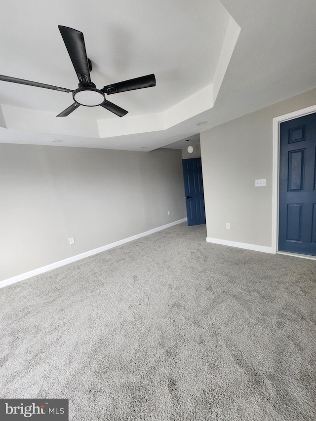 901 N Luzerne Ave, Baltimore, MD 21205 - unfurnished room with ceiling fan, baseboards, carpet floors, and a raised ceiling