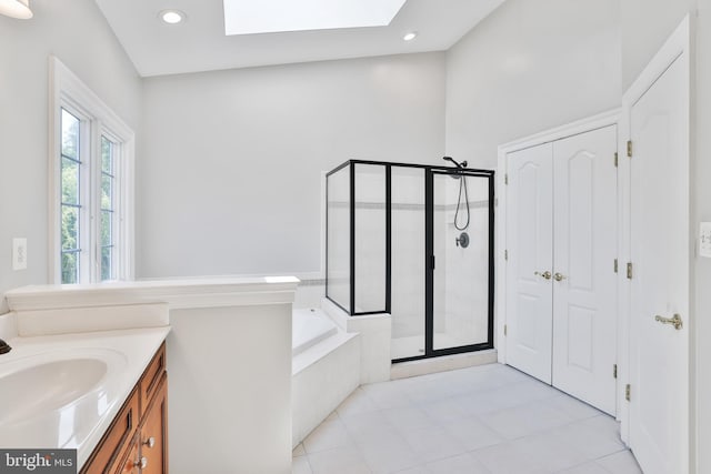 16328 Limestone Ct, Leesburg, VA 20176 - full bath with a skylight, a shower stall, a bath, vanity, and tile patterned flooring