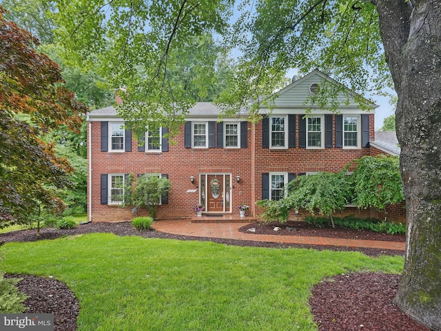 2624 Black Fir Ct, Reston, VA 20191 - colonial house featuring a front yard and brick siding