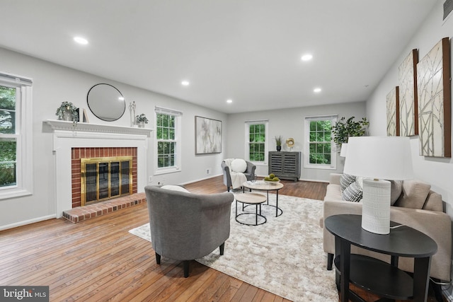 2624 Black Fir Ct, Reston, VA 20191 - living room with plenty of natural light, hardwood / wood-style flooring, a brick fireplace, recessed lighting, and baseboards