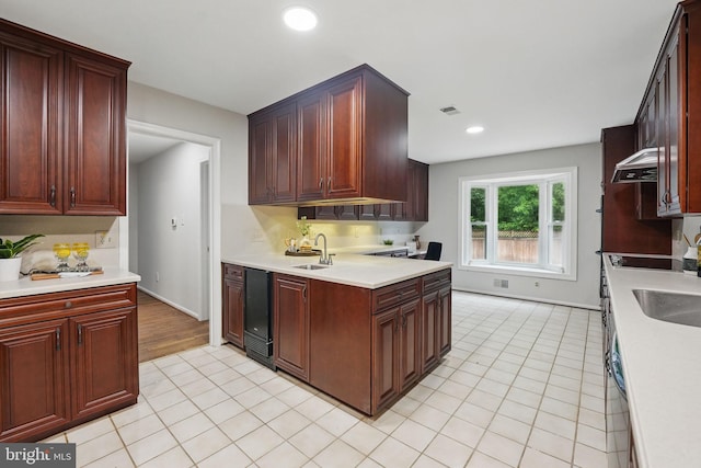 2624 Black Fir Ct, Reston, VA 20191 - kitchen featuring light countertops, light tile patterned flooring, recessed lighting, a sink, and baseboards