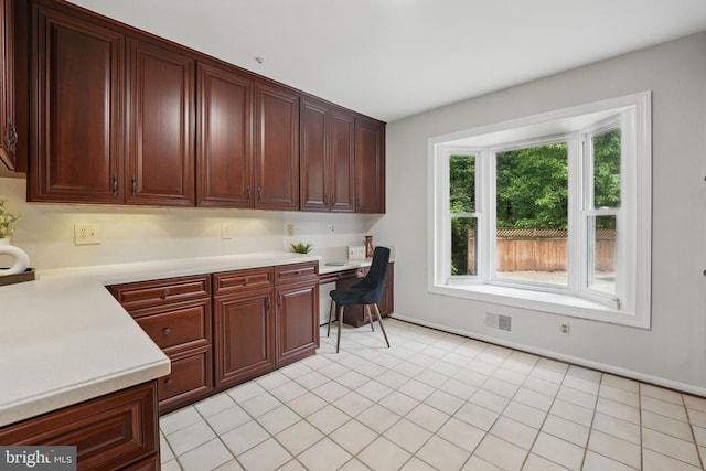 2624 Black Fir Ct, Reston, VA 20191 - kitchen with light countertops and dark brown cabinets