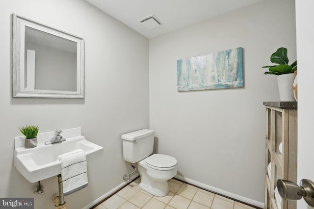 2624 Black Fir Ct, Reston, VA 20191 - half bathroom with toilet, baseboards, and tile patterned flooring