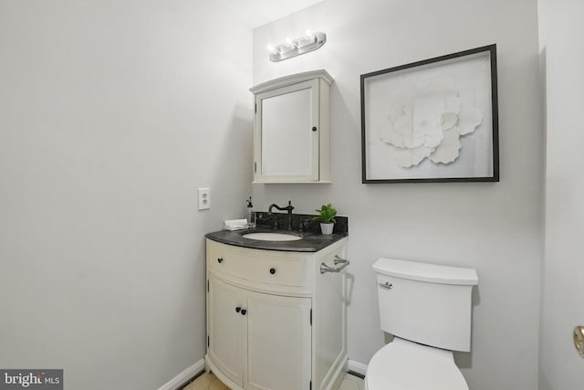 2624 Black Fir Ct, Reston, VA 20191 - half bath featuring vanity, toilet, and baseboards
