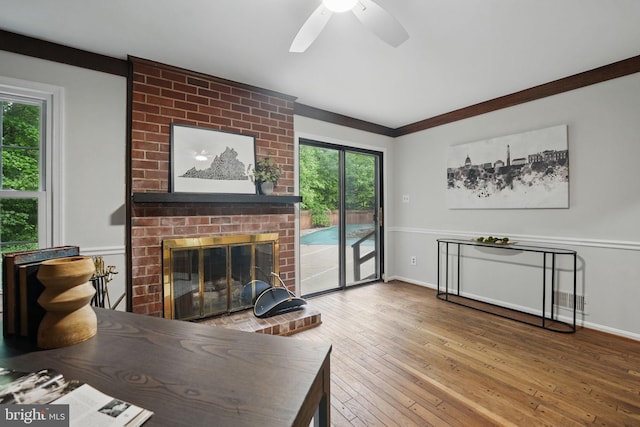 2624 Black Fir Ct, Reston, VA 20191 - living area featuring ceiling fan, hardwood / wood-style floors, a brick fireplace, and baseboards