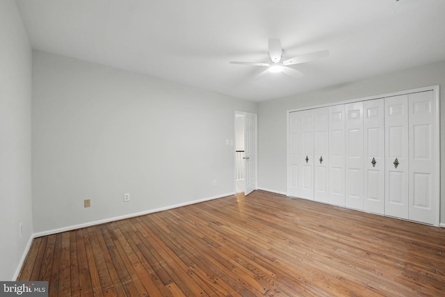 2624 Black Fir Ct, Reston, VA 20191 - unfurnished bedroom featuring baseboards, hardwood / wood-style flooring, a closet, and a ceiling fan