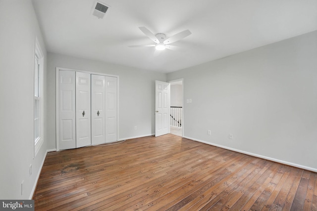 2624 Black Fir Ct, Reston, VA 20191 - unfurnished bedroom featuring hardwood / wood-style floors, baseboards, and a closet