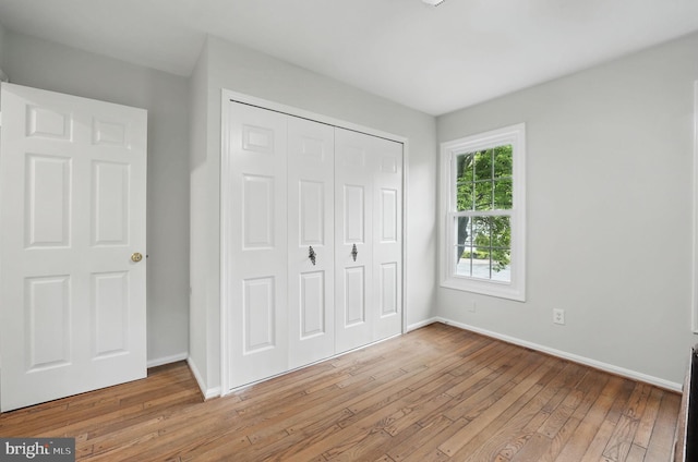 2624 Black Fir Ct, Reston, VA 20191 - unfurnished bedroom featuring light wood finished floors, baseboards, and a closet