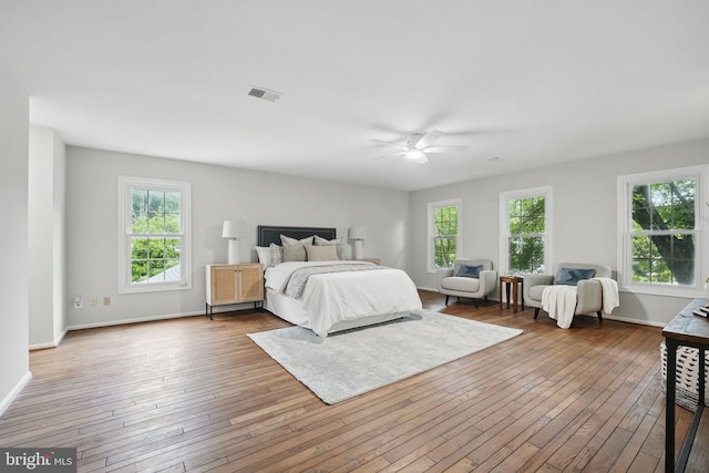 2624 Black Fir Ct, Reston, VA 20191 - bedroom with multiple windows, hardwood / wood-style floors, baseboards, and ceiling fan