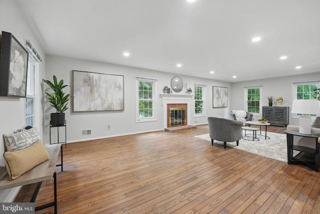 2624 Black Fir Ct, Reston, VA 20191 - living room with hardwood / wood-style flooring, a brick fireplace, recessed lighting, and baseboards