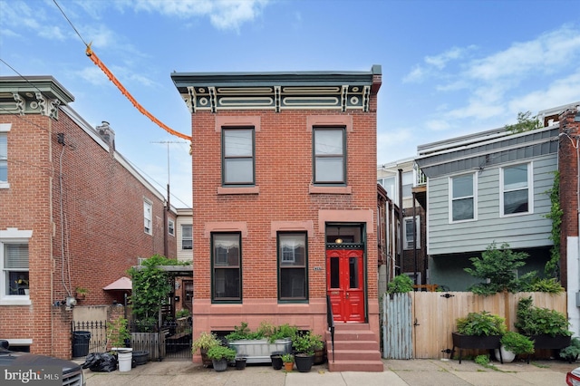 2347 E Norris St, Philadelphia, PA 19125 - view of front facade with brick siding, a gate, and entry steps