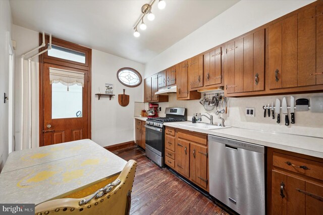 2347 E Norris St, Philadelphia, PA 19125 - kitchen featuring stainless steel appliances, a sink, under cabinet range hood, light countertops, and dark wood-style floors