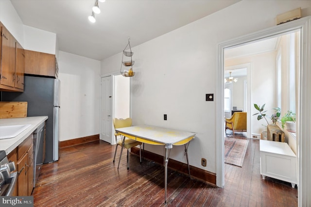 2347 E Norris St, Philadelphia, PA 19125 - kitchen with brown cabinetry, dishwasher, dark wood finished floors, and light countertops