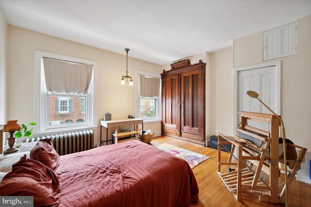 2347 E Norris St, Philadelphia, PA 19125 - bedroom featuring radiator heating unit and wood finished floors