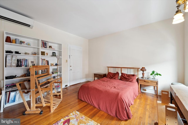 2347 E Norris St, Philadelphia, PA 19125 - bedroom with a wall mounted AC, wood finished floors, and baseboards