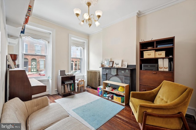 2347 E Norris St, Philadelphia, PA 19125 - living area with radiator, a chandelier, wood finished floors, and ornamental molding