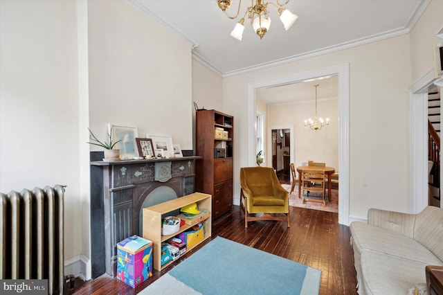 2347 E Norris St, Philadelphia, PA 19125 - living room featuring a chandelier, radiator heating unit, wood-type flooring, ornamental molding, and a fireplace