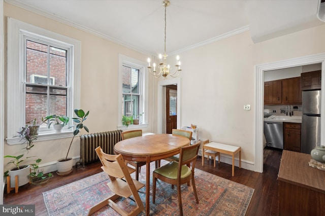 2347 E Norris St, Philadelphia, PA 19125 - dining space featuring radiator, a chandelier, dark wood-style flooring, ornamental molding, and baseboards