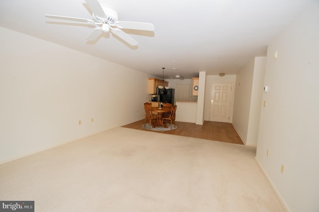 1103 S Schumaker Dr Unit C-201, Salisbury, MD 21804 - unfurnished living room featuring light colored carpet and ceiling fan