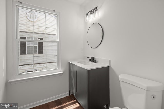 9439 Fens Holw, Laurel, MD 20723 - half bath with toilet, vanity, wood finished floors, and baseboards