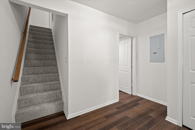 9439 Fens Holw, Laurel, MD 20723 - staircase featuring electric panel, wood finished floors, and baseboards