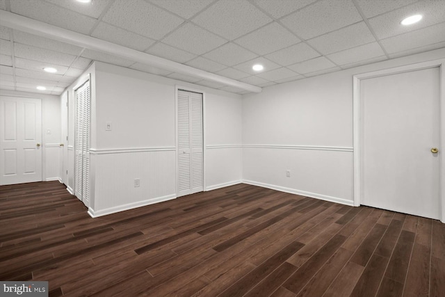 9439 Fens Holw, Laurel, MD 20723 - finished basement with wood finished floors, a drop ceiling, recessed lighting, baseboards, and wainscoting