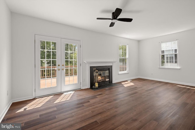 9439 Fens Holw, Laurel, MD 20723 - unfurnished living room with french doors, dark wood-type flooring, a fireplace with flush hearth, baseboards, and a ceiling fan