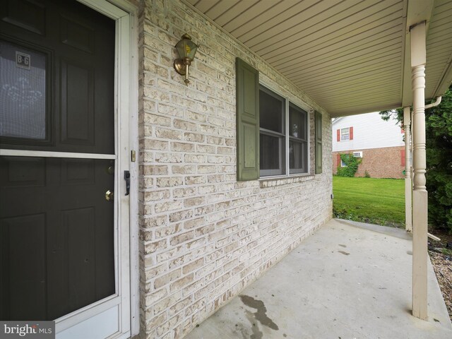 14754 Sherwood Dr, Greencastle, PA 17225 - property entrance featuring a porch and brick siding