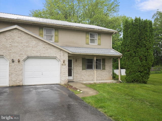 14754 Sherwood Dr, Greencastle, PA 17225 - view of front of property with a front lawn, driveway, metal roof, and brick siding