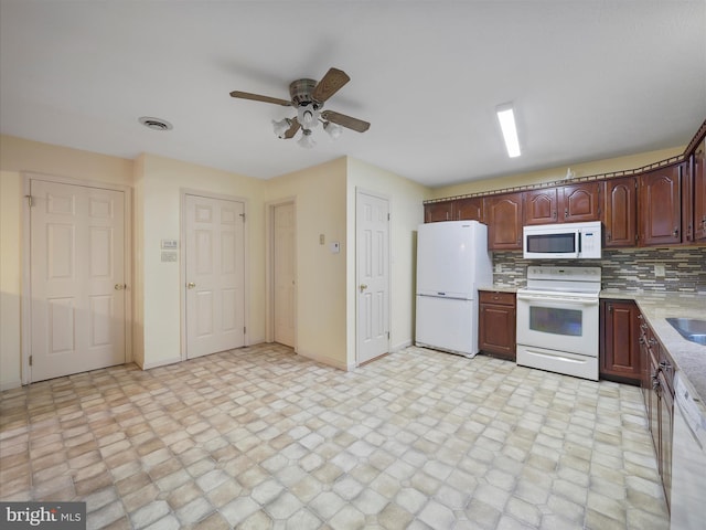 14754 Sherwood Dr, Greencastle, PA 17225 - kitchen with white appliances, light countertops, baseboards, ceiling fan, and backsplash