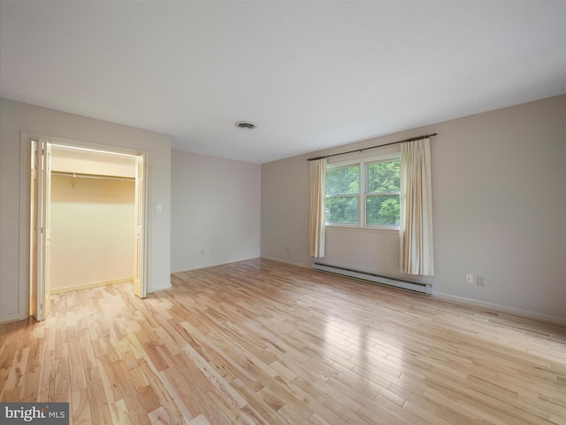 14754 Sherwood Dr, Greencastle, PA 17225 - empty room featuring baseboard heating, light wood-style floors, and baseboards
