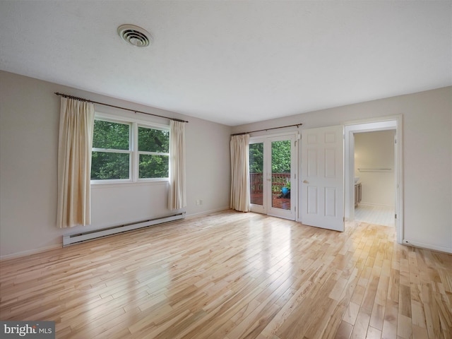 14754 Sherwood Dr, Greencastle, PA 17225 - spare room with a baseboard radiator, light wood-type flooring, and baseboards