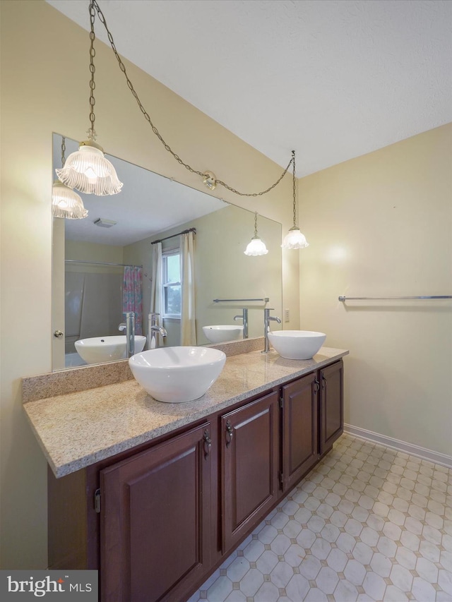 14754 Sherwood Dr, Greencastle, PA 17225 - bathroom featuring tile patterned floors, double vanity, baseboards, and a shower with curtain