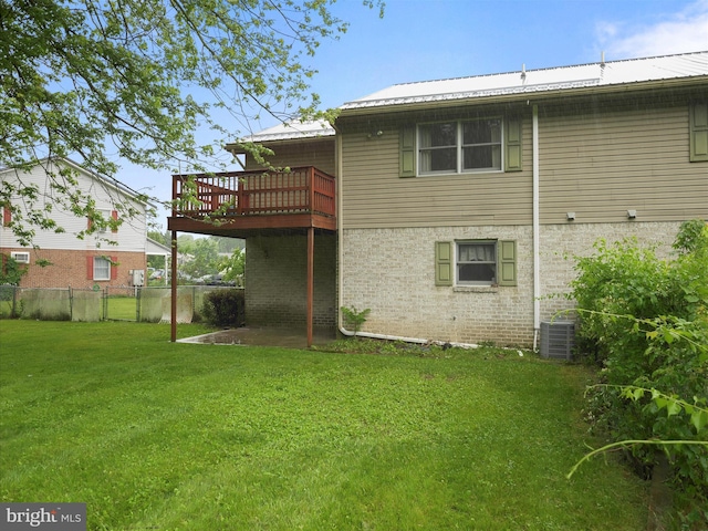 14754 Sherwood Dr, Greencastle, PA 17225 - back of property with metal roof, a wooden deck, and brick siding