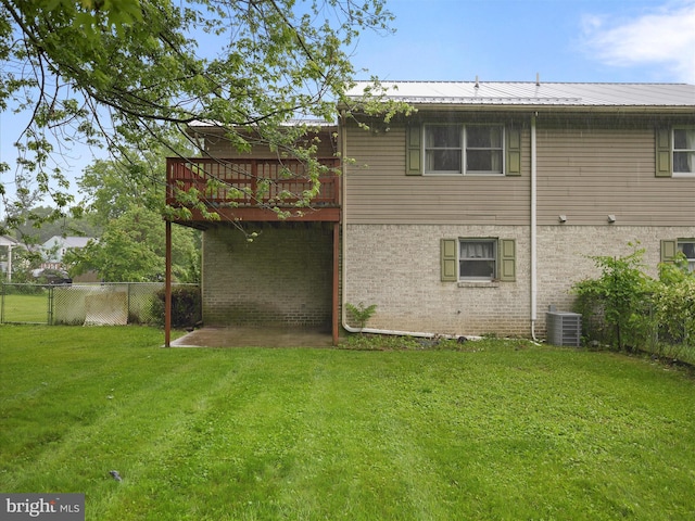 14754 Sherwood Dr, Greencastle, PA 17225 - rear view of property with central AC unit, a deck, and metal roof